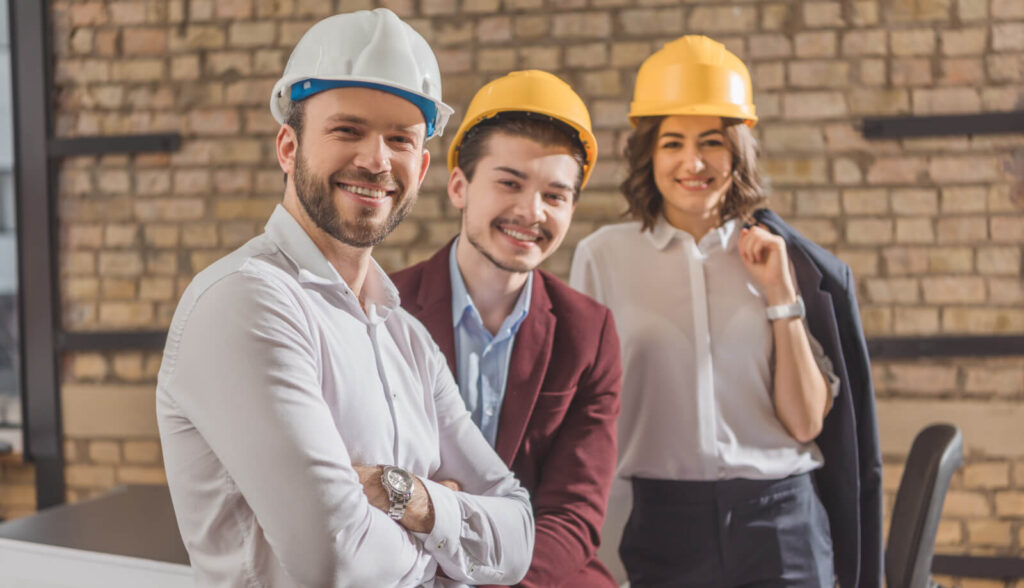 A team of two men and women discussing the plumbing service solutions.
